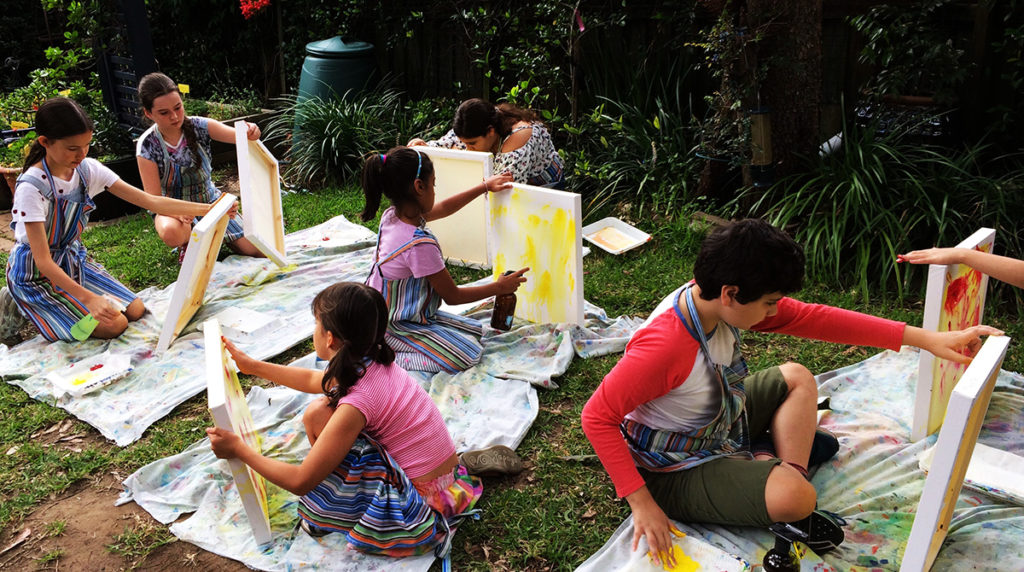 children painting in the garden at Art Box Workshops
