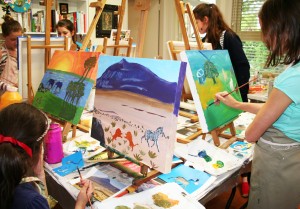 children painting in a studio