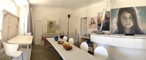 Art studio with large portrait paintings